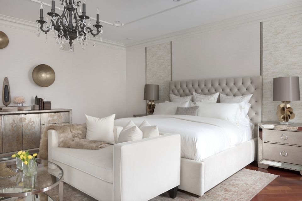 White bedroom designed by Diana Rose with chandelier